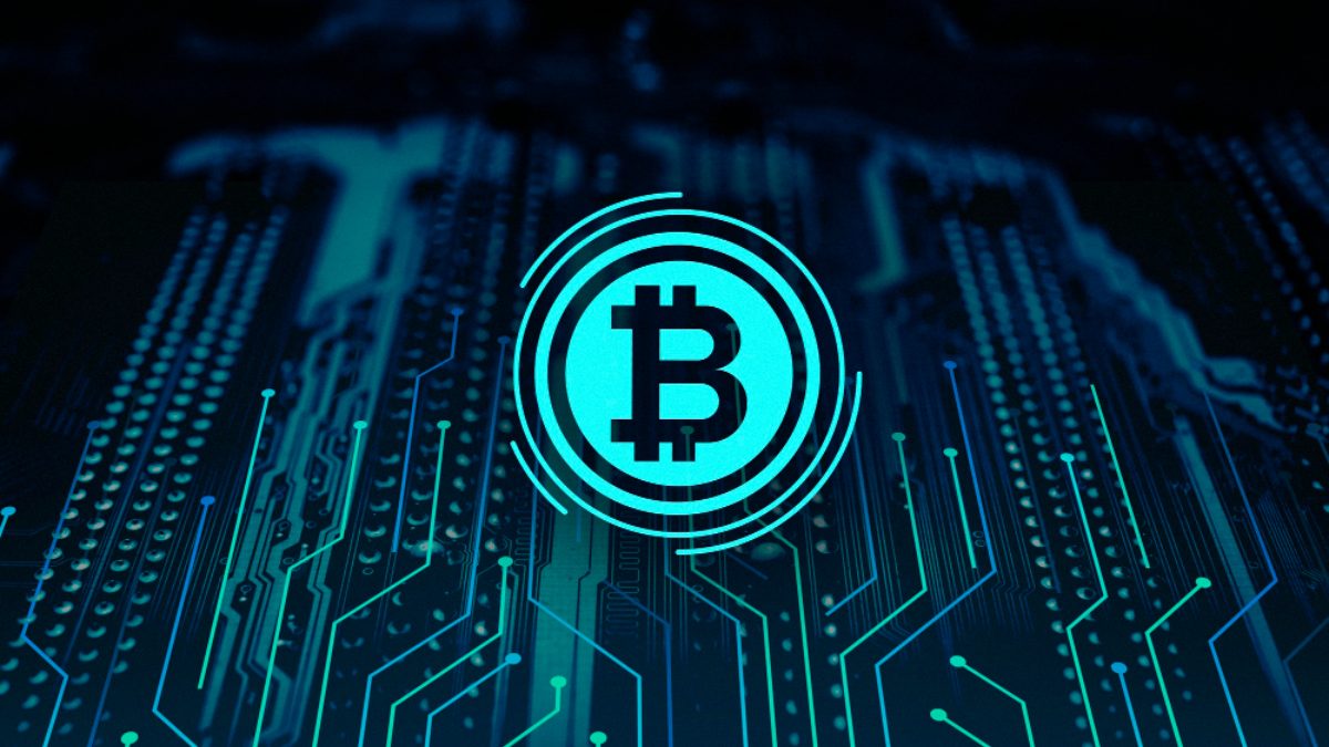 A glowing bitcoin symbol over a circuit board.