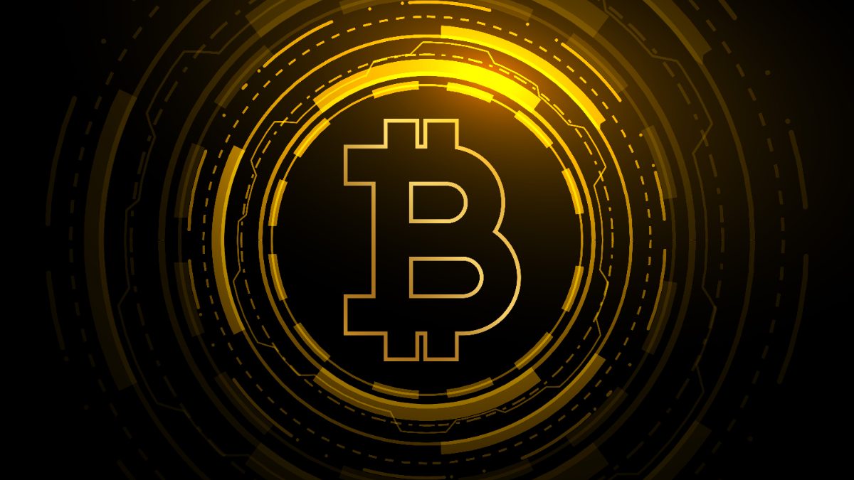 A glowing gold bitcoin symbol on a dark background.