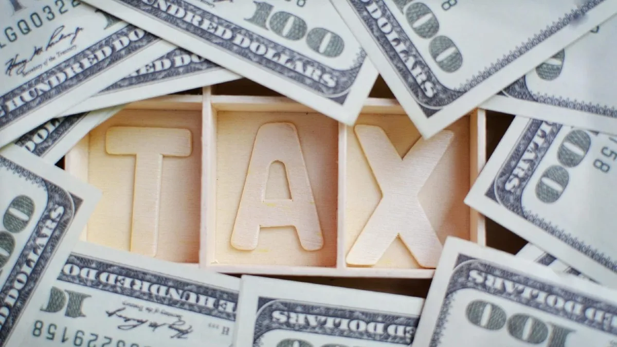 Comparing the U.S. Capitol (representing federal tax) and a state capitol building (representing state tax).