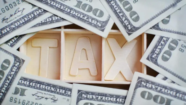 Comparing the U.S. Capitol (representing federal tax) and a state capitol building (representing state tax).